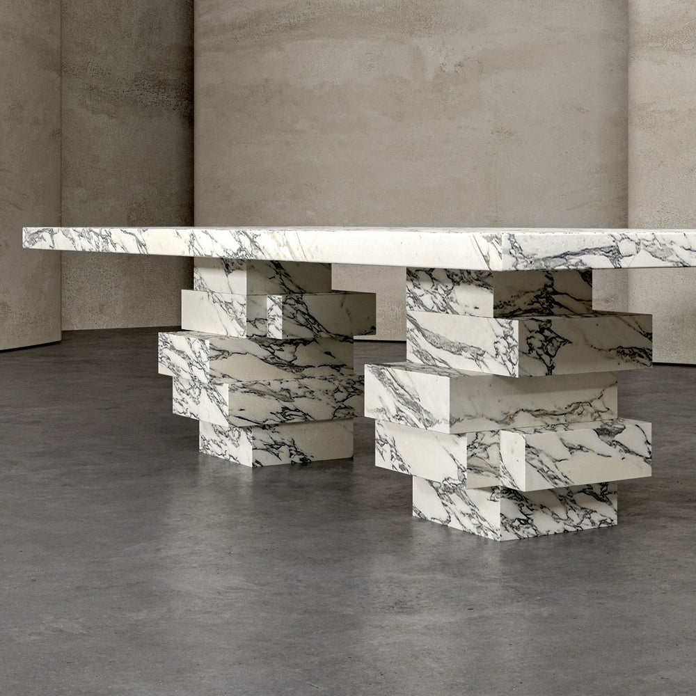 A marble dining table with a stone base